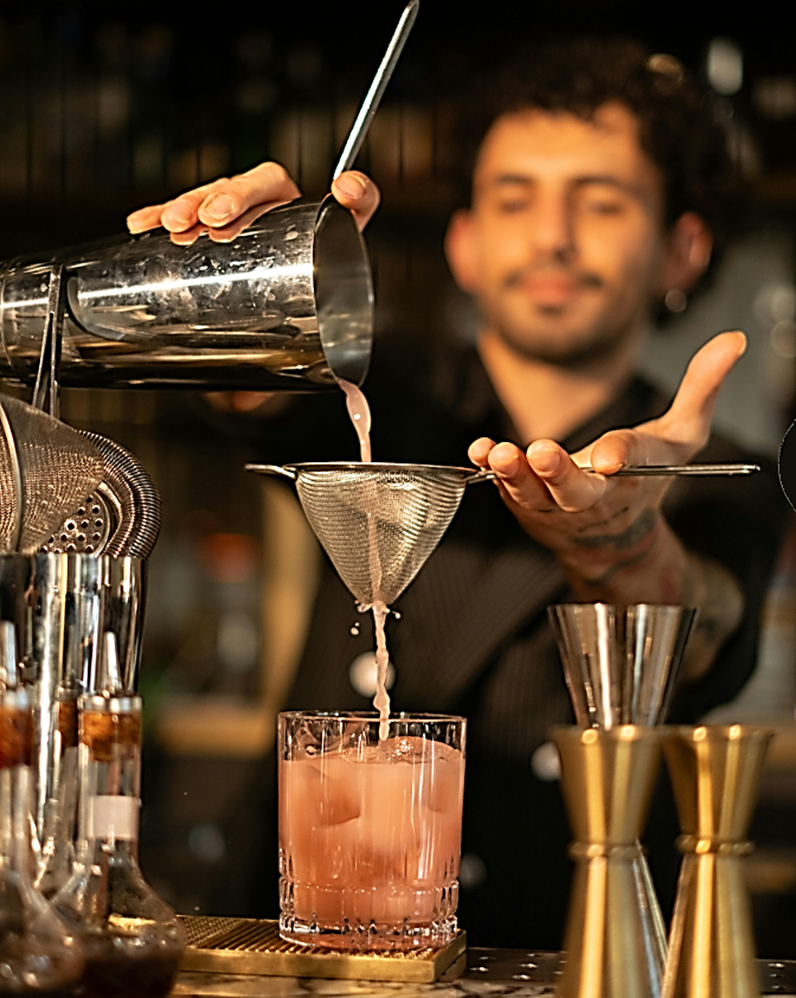 Mixologist crafting a cocktail