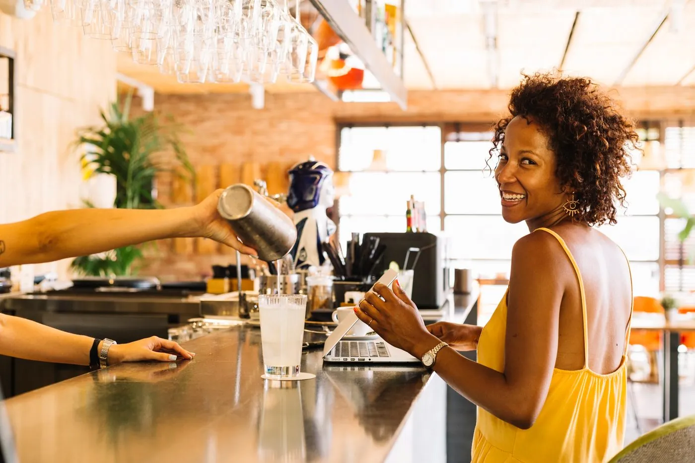 Customer at a bar exploring drinks