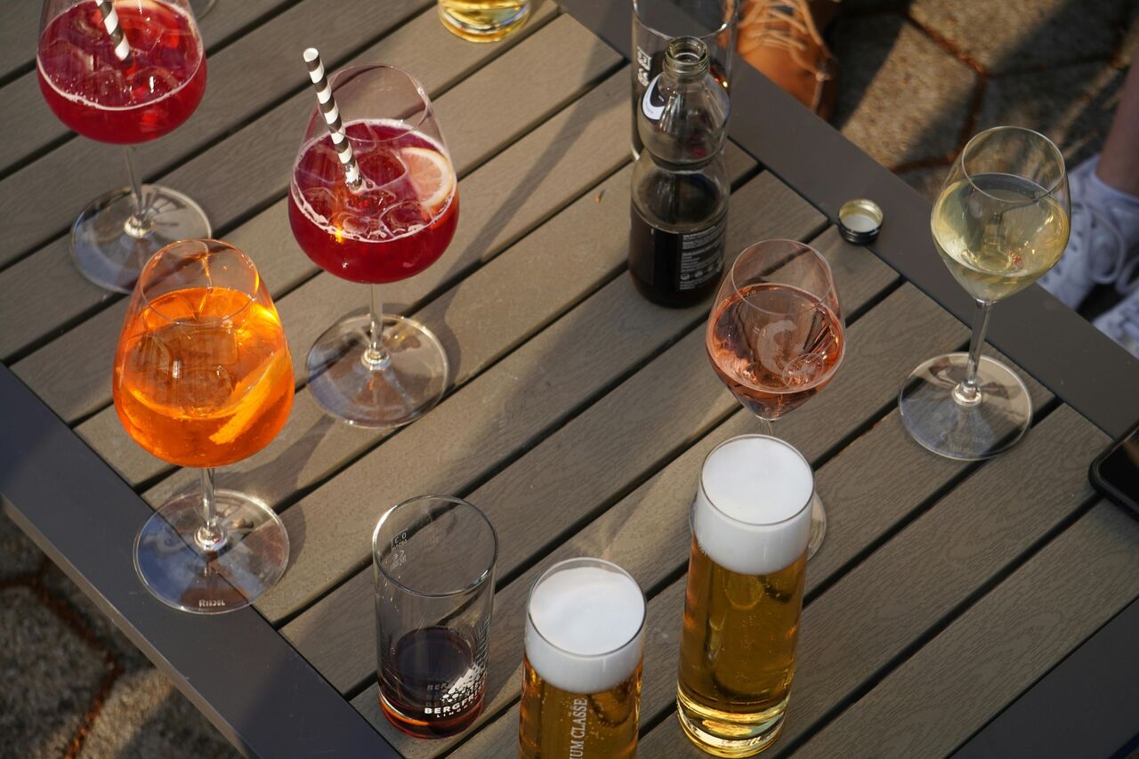 Drinks on a wooden table at golden hour